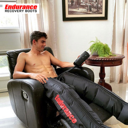 A man is on the couch wearing Endurance Active Recovery Boots